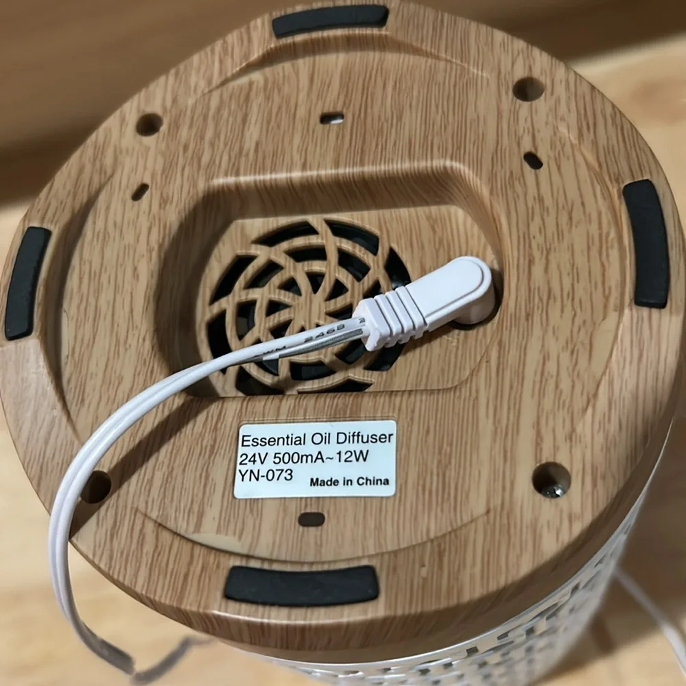 White Ceramic Aromatherapy Diffuser with a bottle of FOCUS essential oil